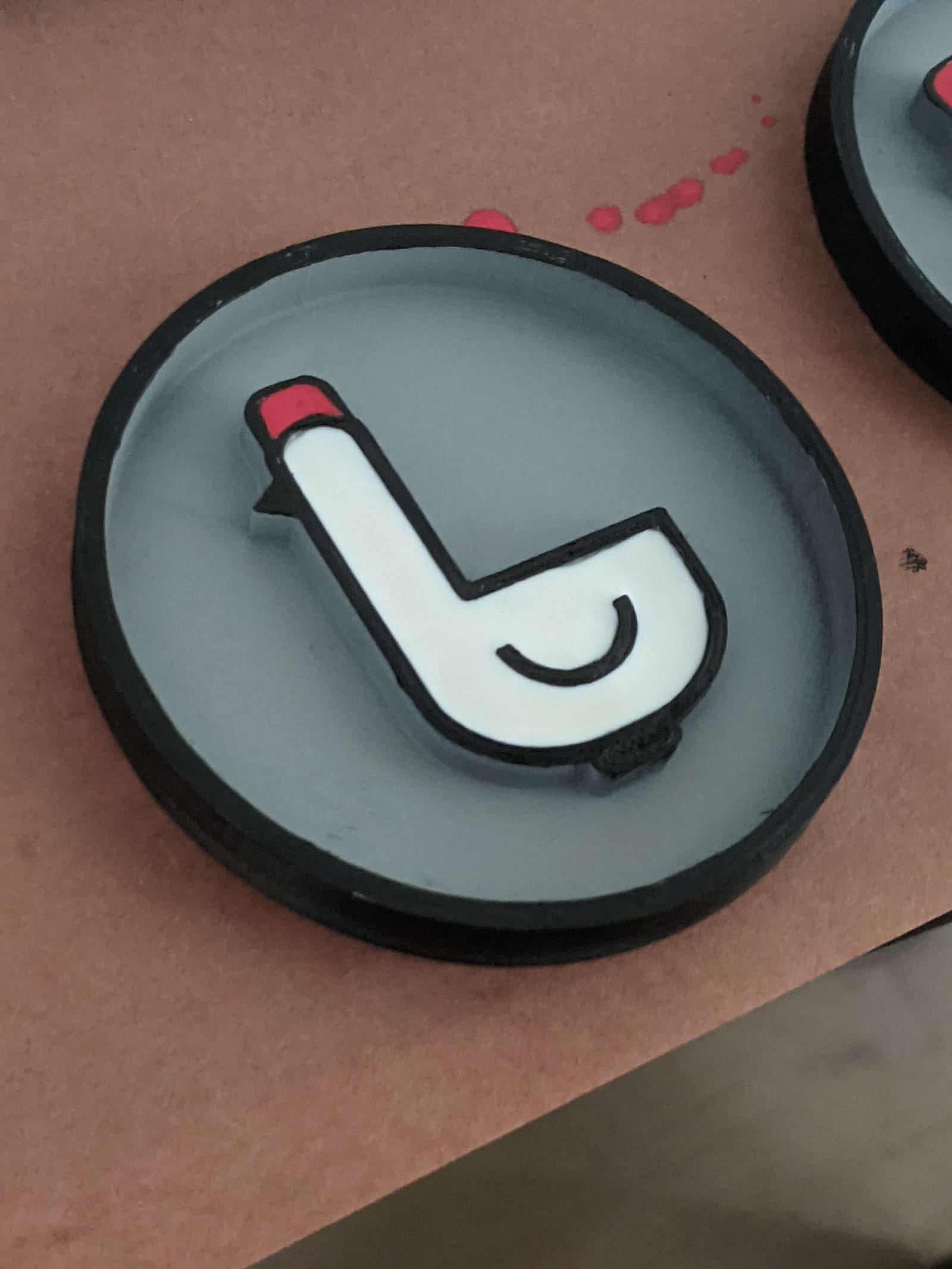 Logo coaster — a sourced model I 3D printed