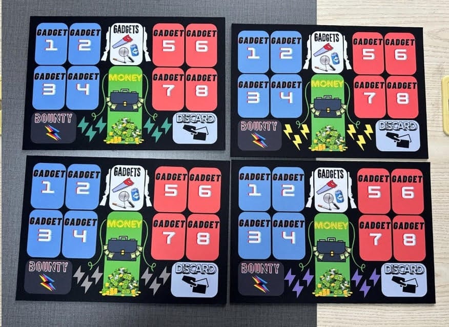 The printed GADGET mats laid out on the table