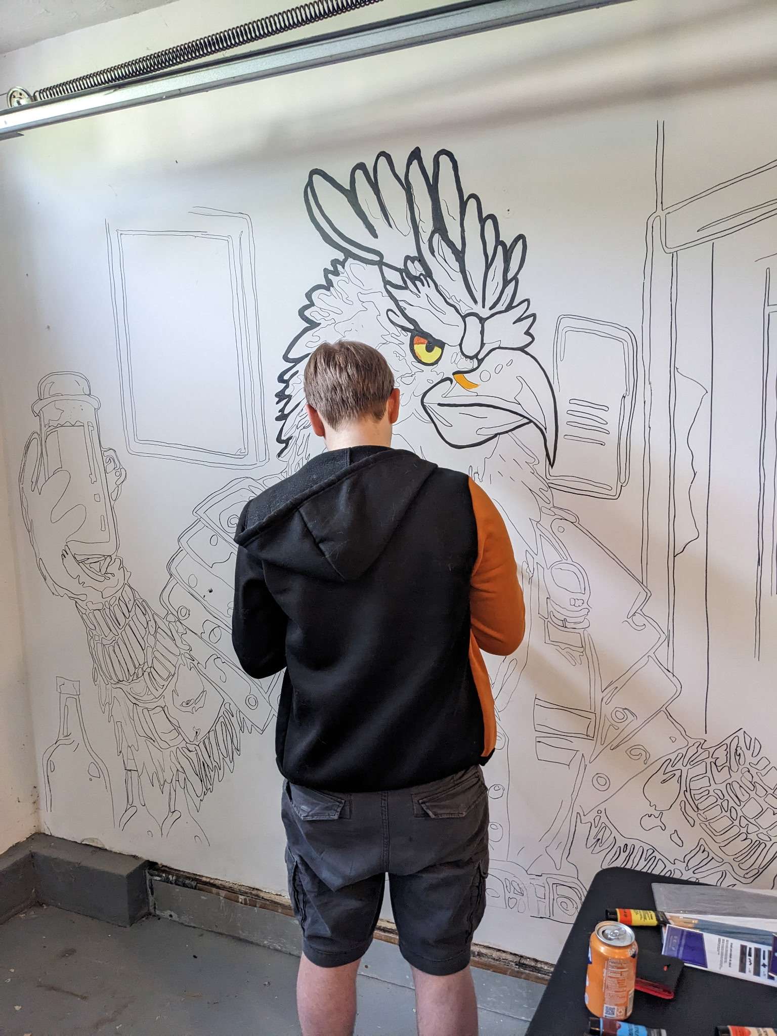 Chicken bartender mural — hand-painted line work in progress