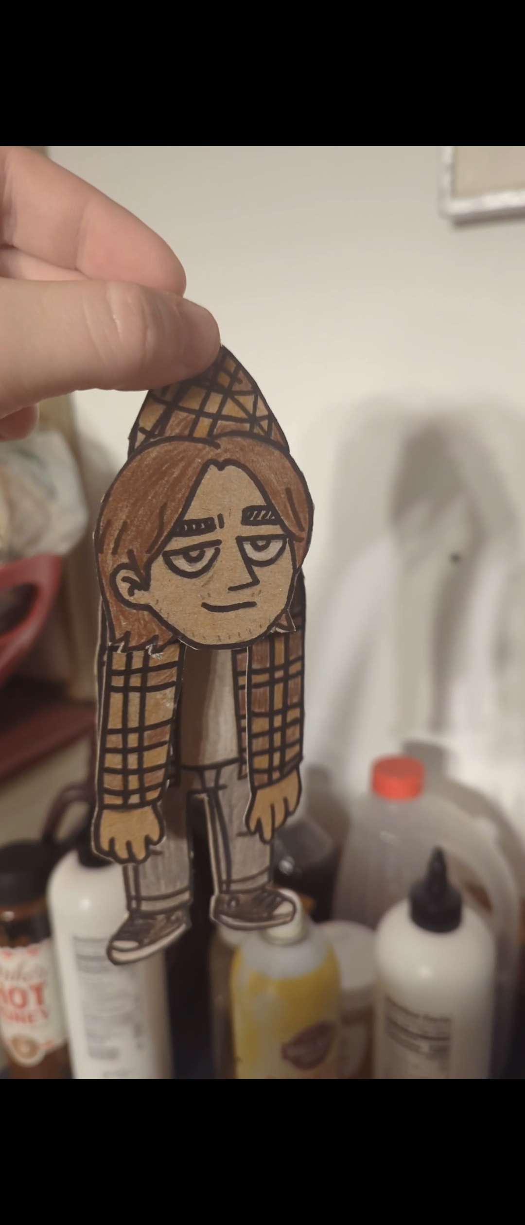Cardboard puppet of myself — hand-drawn, colored, and cut out